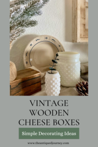 Winter decor with a wooden cheese box