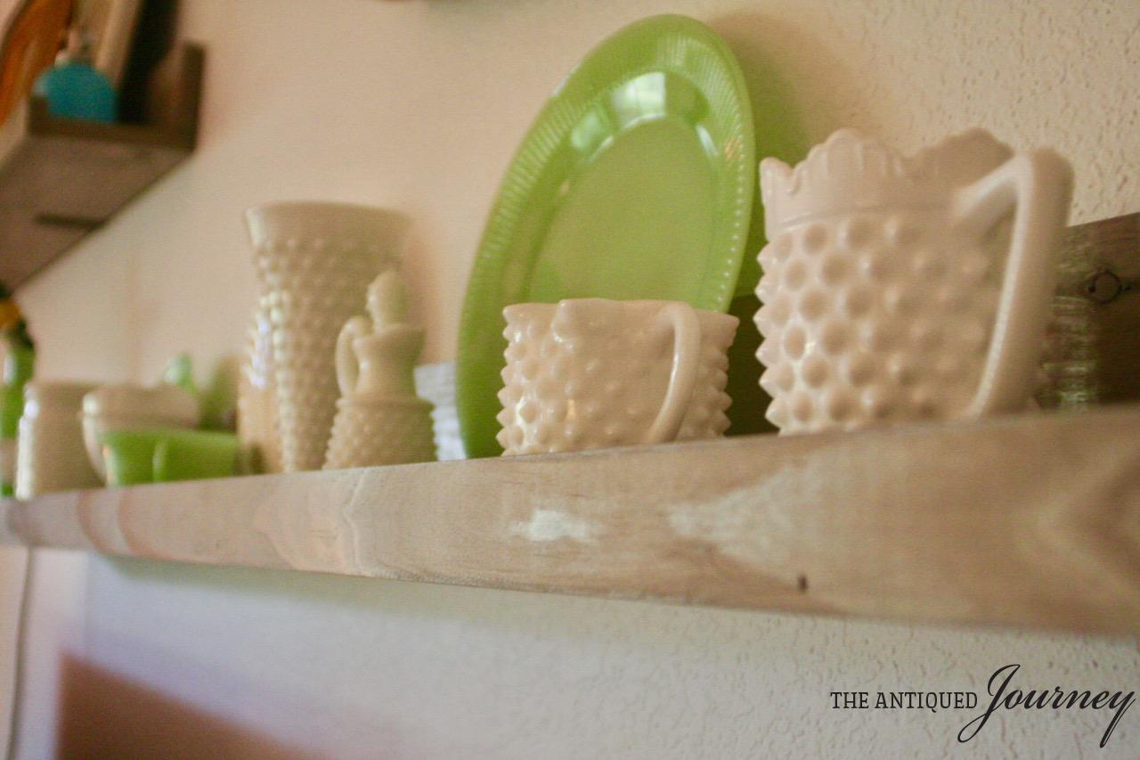 hobnail glass collection on a picture rail