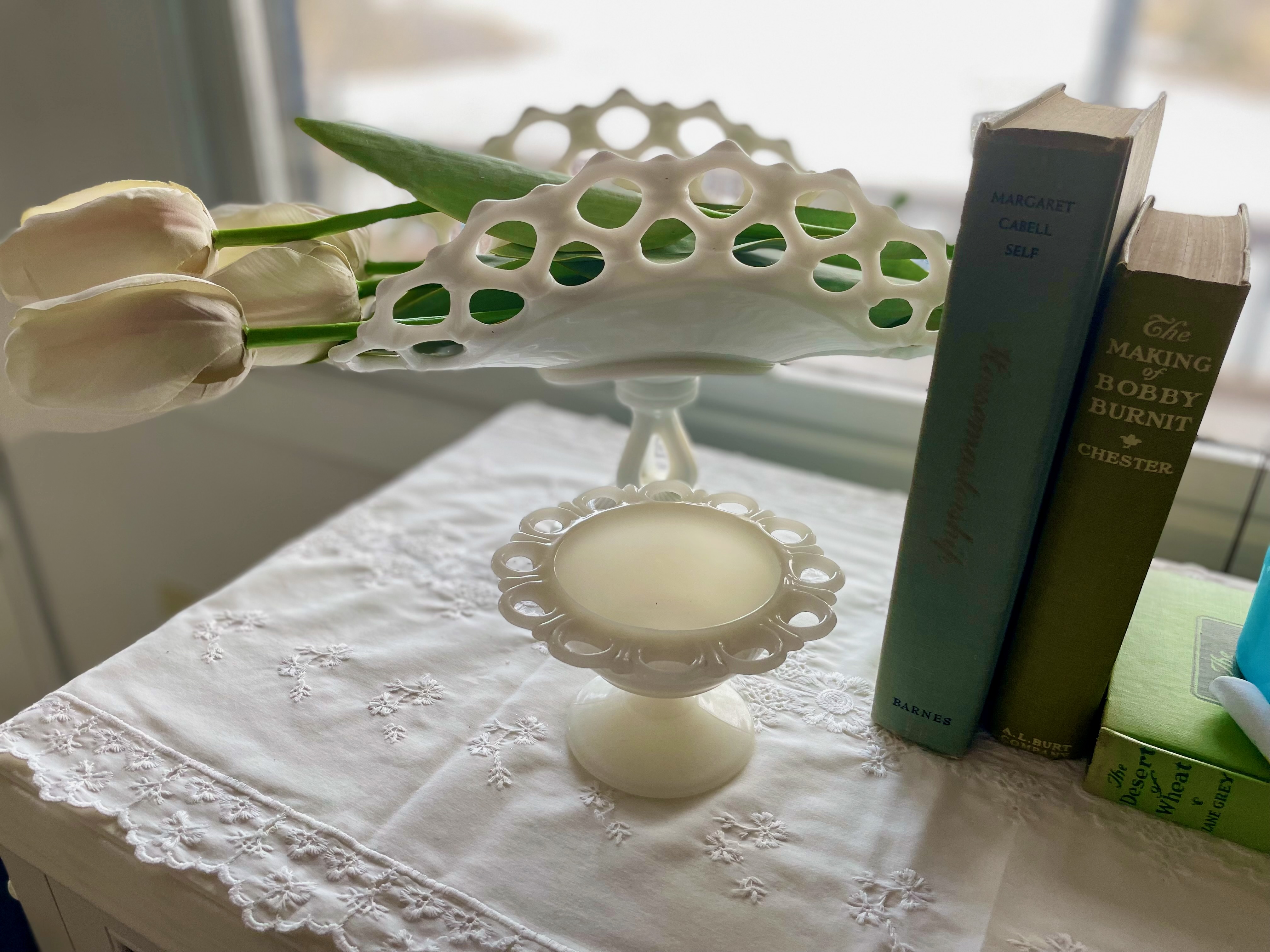 vintage milk glass displayed in a vignette for Spring