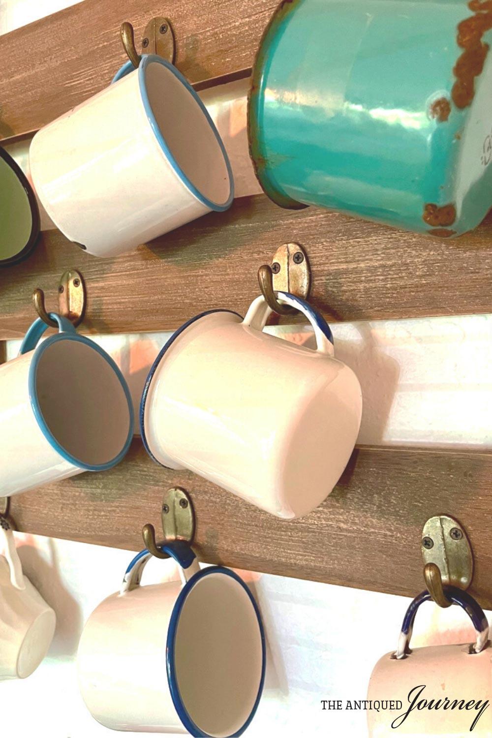 a collection of vintage enamelware cups