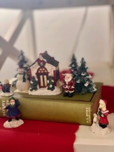 a vintage book with a Christmas village display
