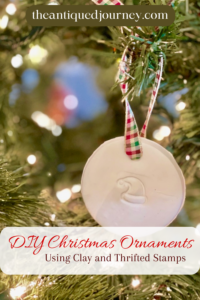 a handmade clay Christmas ornament hanging on a tree