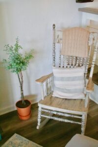 finished DIY faux topiary next to a rocking chair
