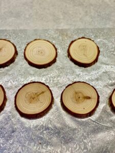 traced letters on wood rounds