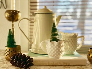 vintage enamelware and milk glass in a vignette