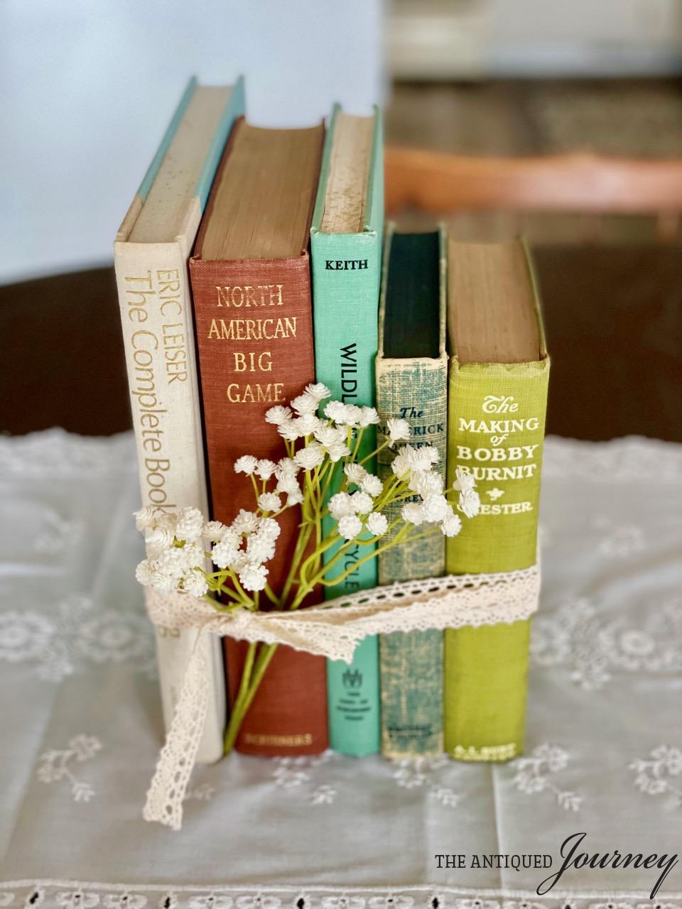 vintage books stacked with a lace ribbon
