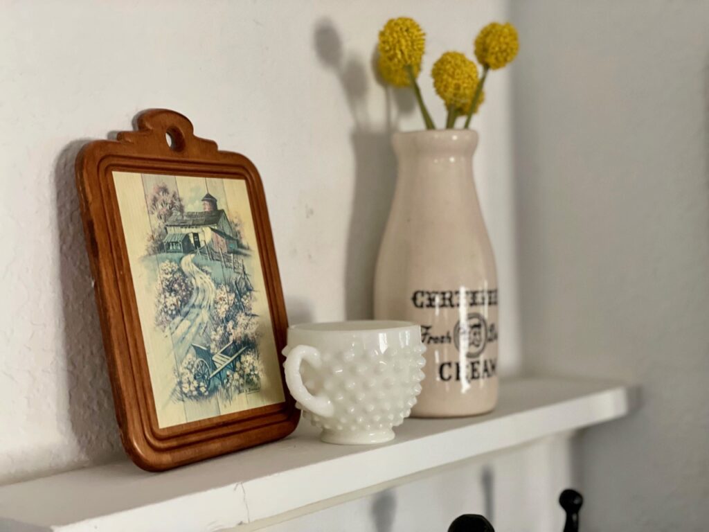 thrifted vintage decor on a shelf