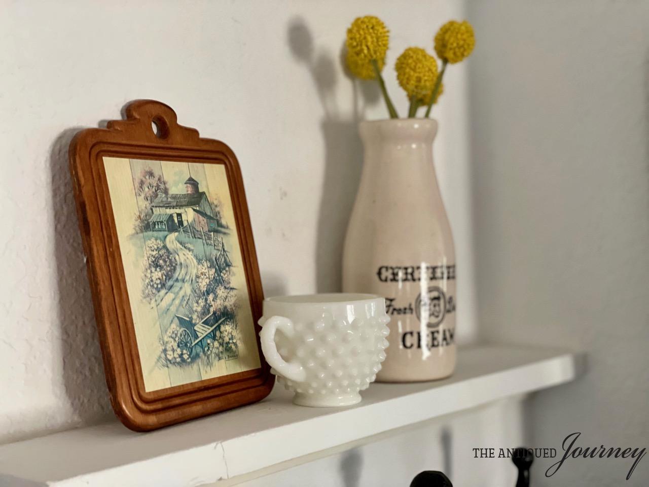 thrifted vintage decor on a shelf