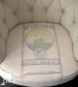 a vintage grain sack re-purposed into a chair cushion