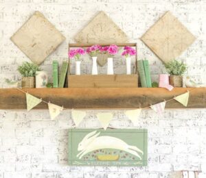 a mantel decorated with vintage finds for Spring