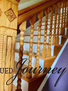 A photo of a prominen wooden staircase in an 1800's Victorian manion.
