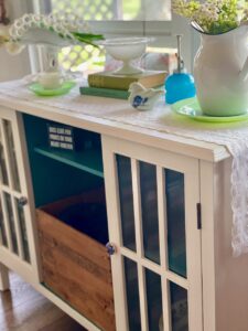 an old cabinet from Target that's been painted creamy white and new knobs added to it