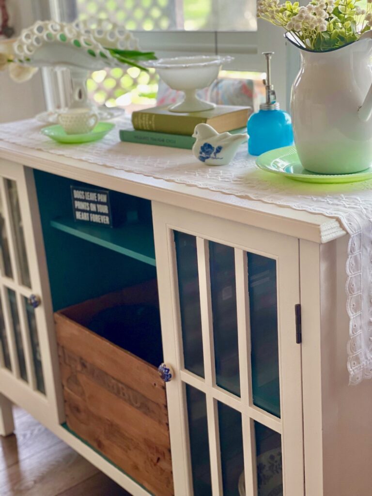 an old cabinet from Target that's been painted creamy white and new knobs added to it