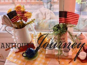 a vintage patriotic display with yellow gingham checked linens