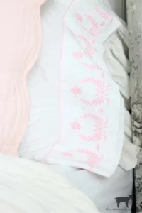 a vintage pink and white pillowcase from The Crowned Goat blog