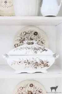 a display with brown and white vintage transferware from The Crowned Goat blog