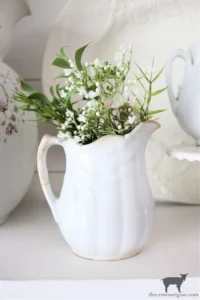 an ironstone pitcher filled with greenery from The Crowned Goat