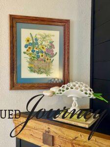 a mantel decorated with vintage finds for the summer