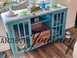 an old teal cabinet from Target with glass doors
