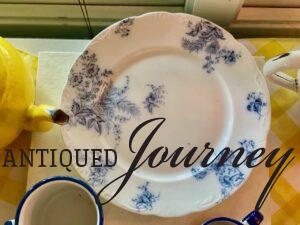 a vintage blue and white plate used in a vignette