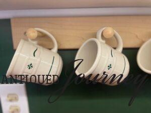 vintage Longaberger coffee mugs on a peg rack