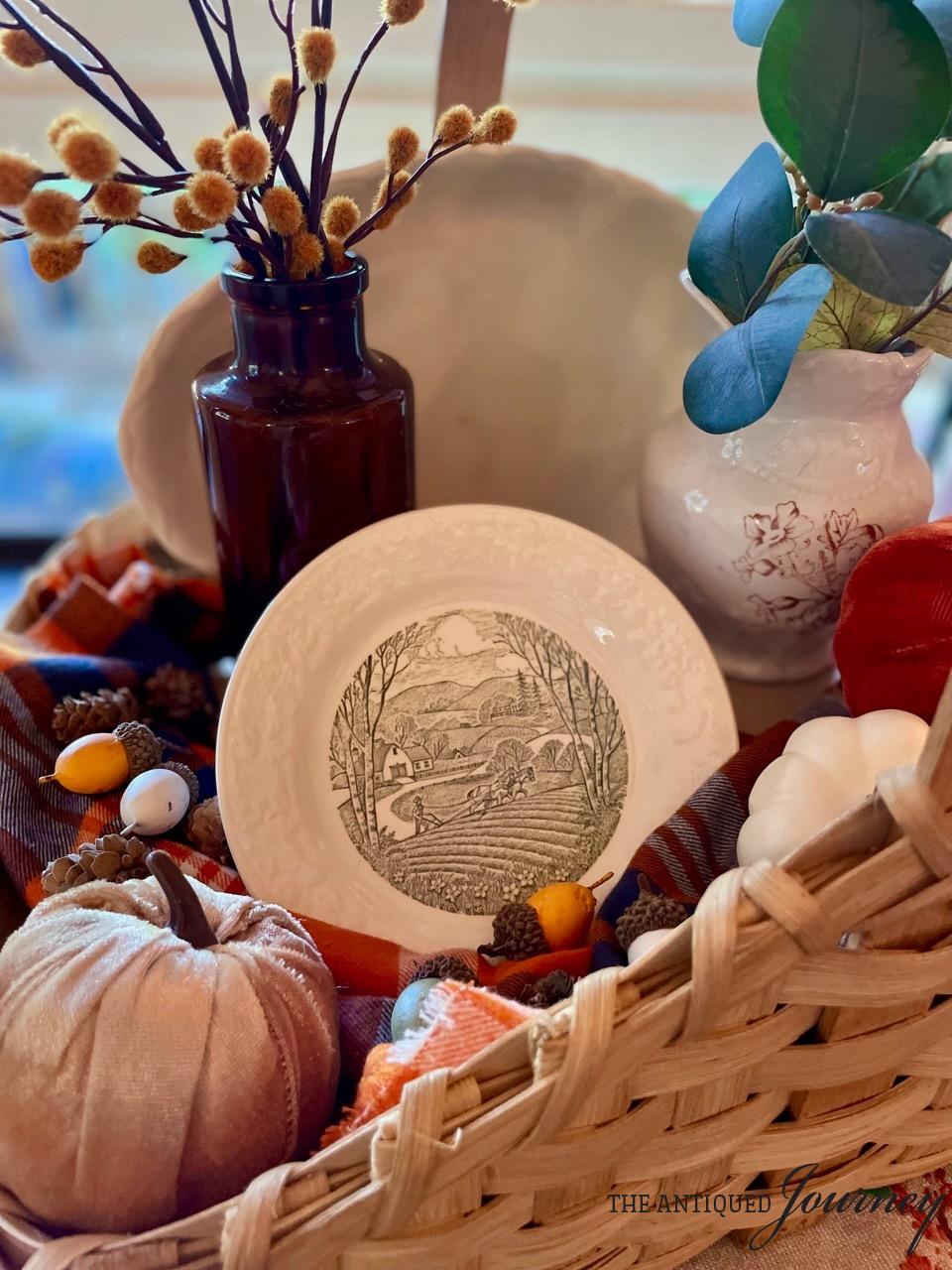 a vintage basket filled with a fall vignette