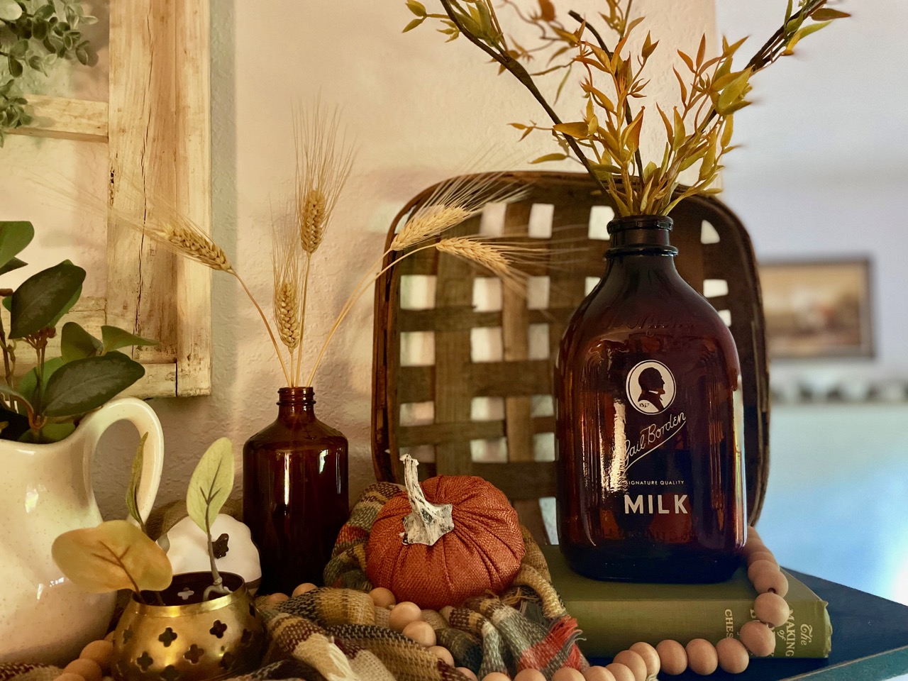 a shelf decorated for fall using textural elements