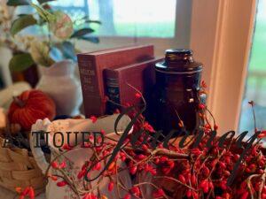 vintage decor for fall including vintage books and ironstone