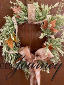 waxed leaves tucked into a wreath for fall