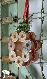 a wreath made out of vintage thread spools from Lora Bloomquist