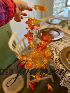 a pre-lit leaf garland for a Thanksgiving table