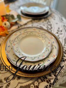 a place setting with vintage dishes for Thanksgiving