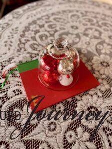 a Christmas centerpiece filled with vintage ornaments