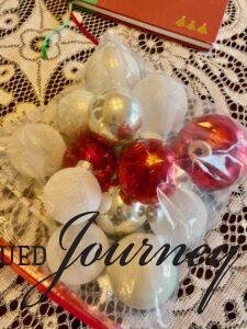 a bag of Christmas ornaments for a centerpiece