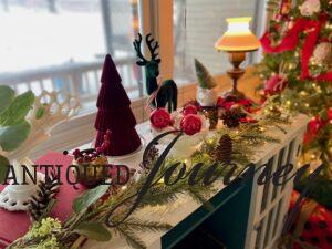 a Christmas vignette with velvet and vintage decor