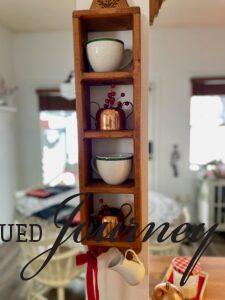 a kitchen shelf with vintage finds displayed