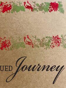 a long stamp with Poinsettias and cardinals on Kraft paper