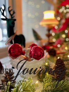 a vintage milk glass bowl filled with vintage ornaments