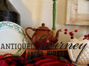 vintage milk glass and enamelware used in a Christmas vignette