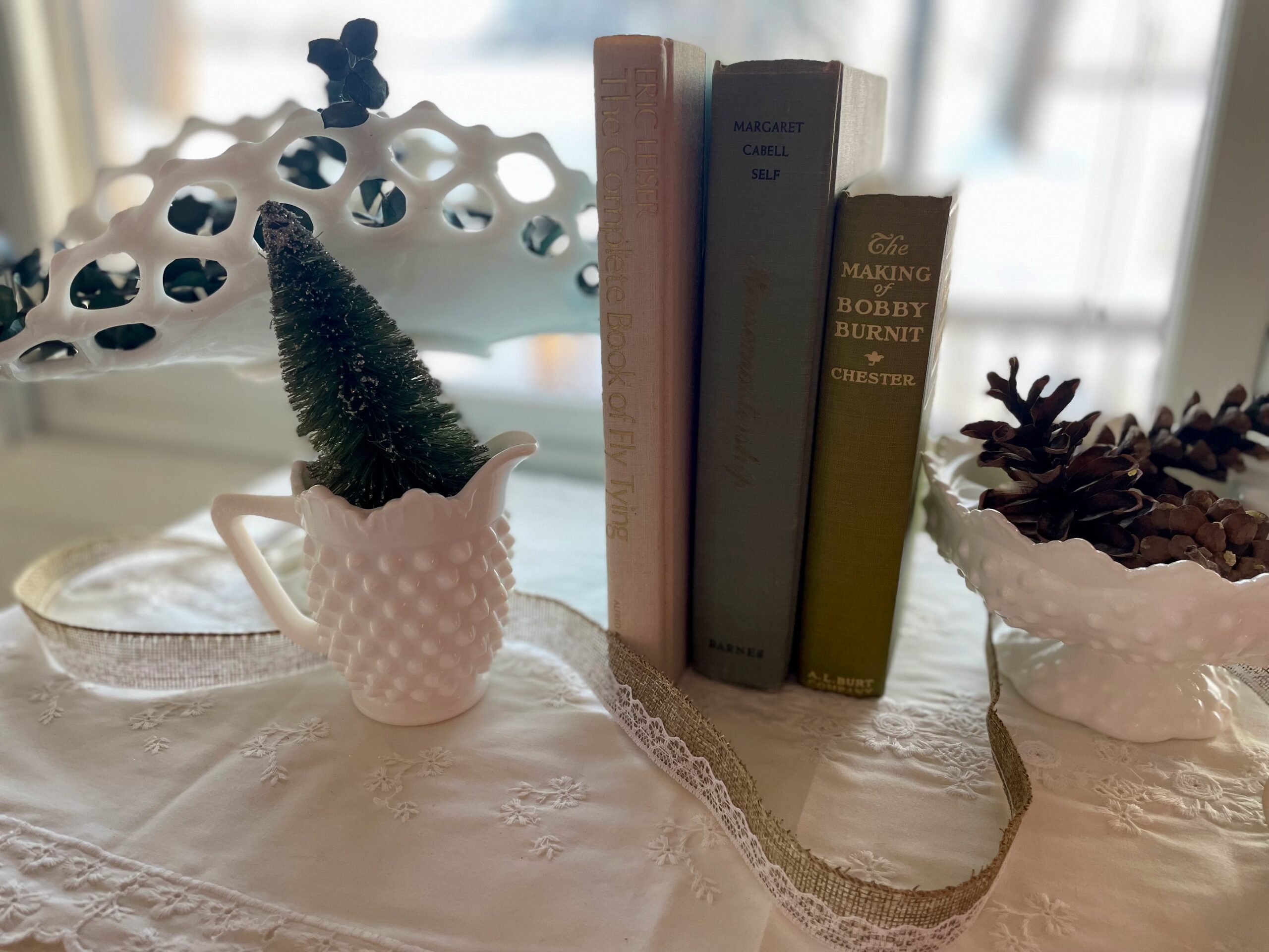 vintage milk glass and decor used for a winter vignette