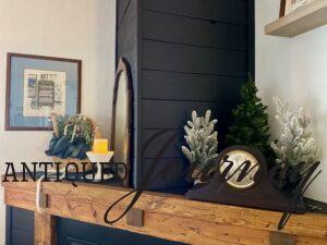 a winter mantel display with vintage decor