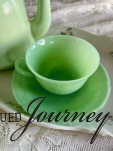 a vintage jadeite cup and saucer used on a Spring tray display