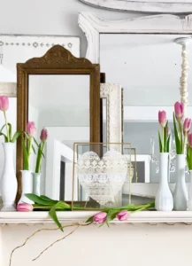 a display of vintage mirrors with tulips from LeCultivateur