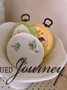 a vintage floral butter pat in a hutch