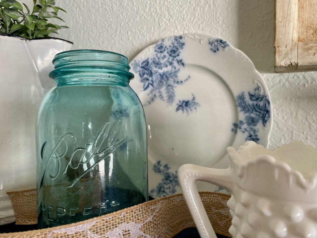 vintage decor used to style a shelf for early Spring