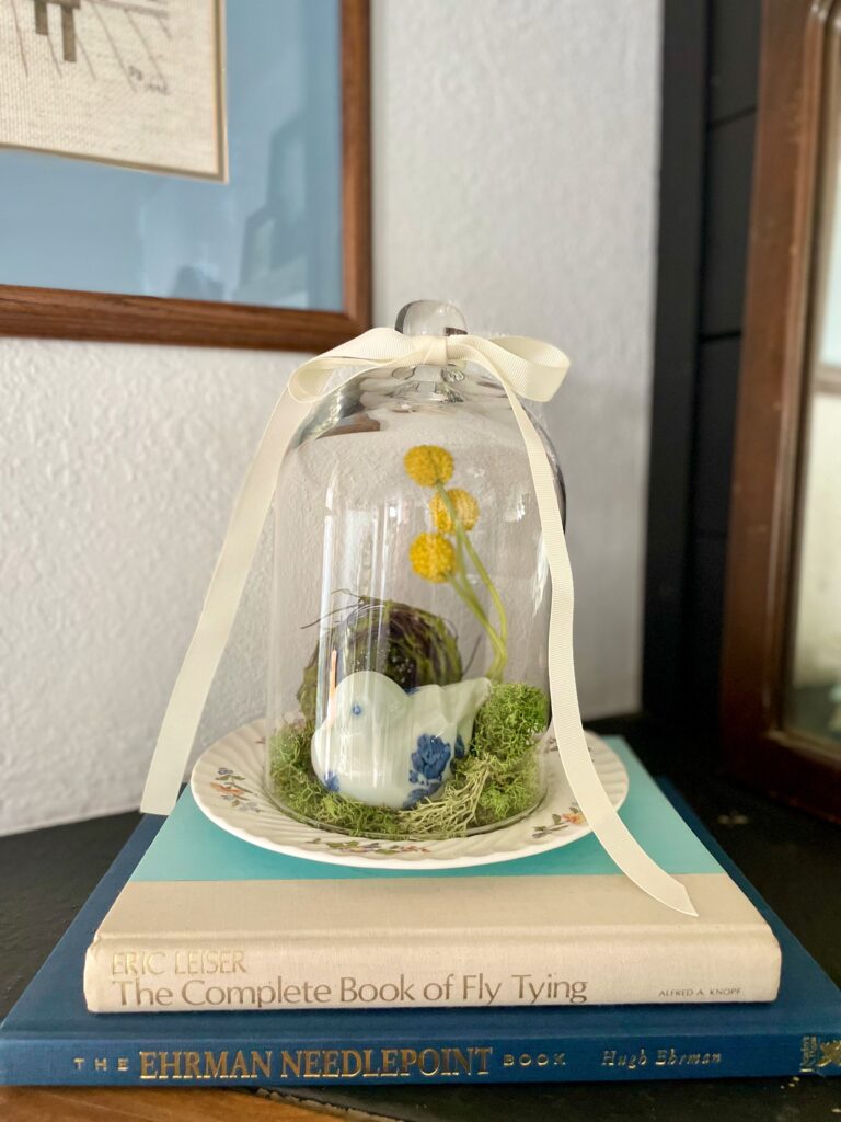 a DIY glass cloche styled for Spring on a mantel