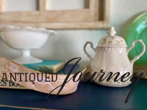 vintage decor on a shelf for Spring with ribbon