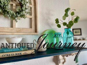 a wall shelf decorated with vintage decor for early Spring