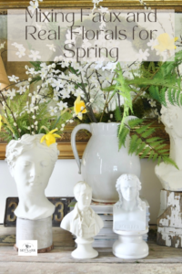 faux florals in head planters from Sky Lark House