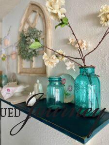 vintage blue jars with Spring stems